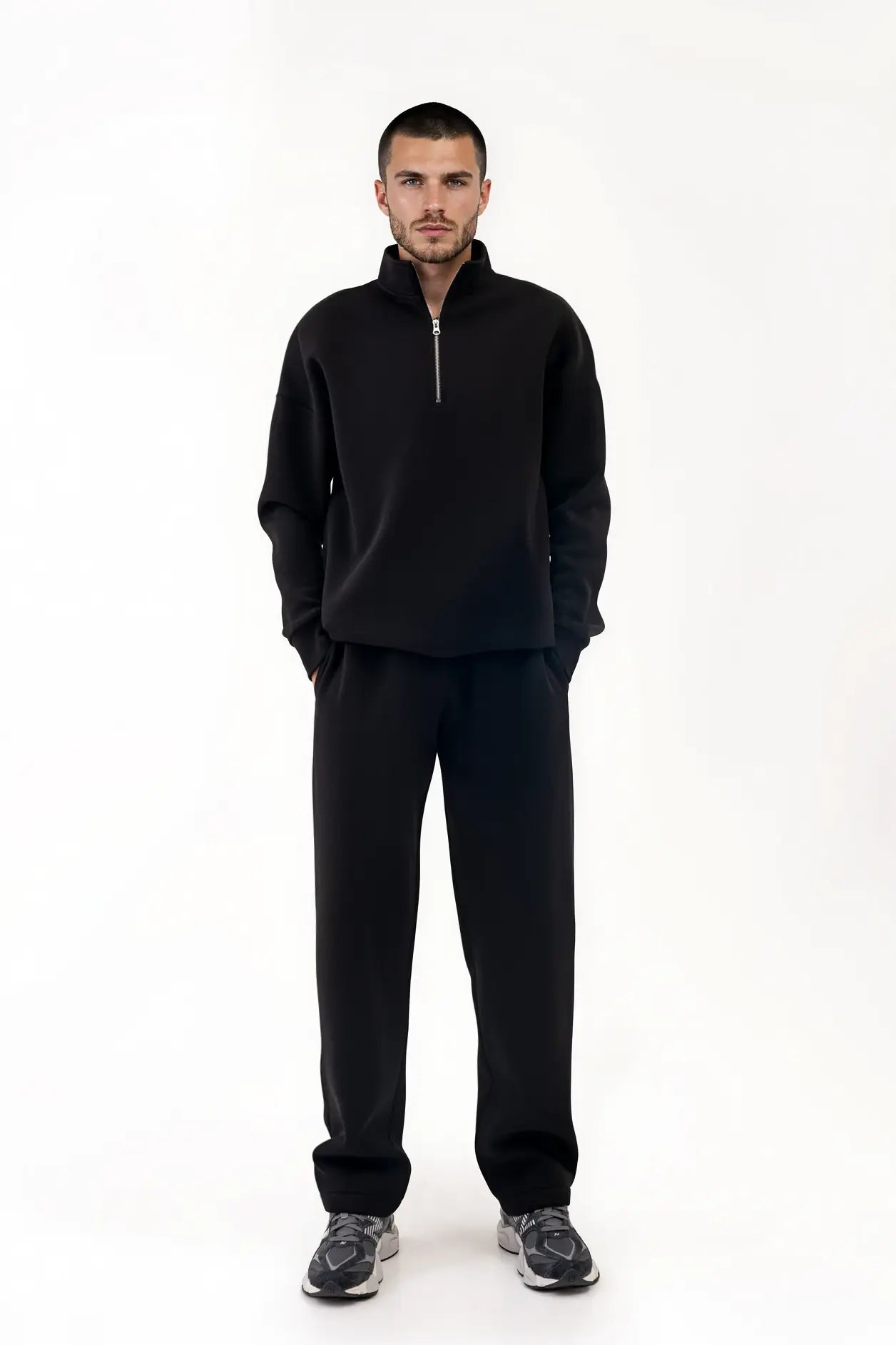 Close-up of the black men's "Vilius" jumper – visible metal half zip and sleeve detail
