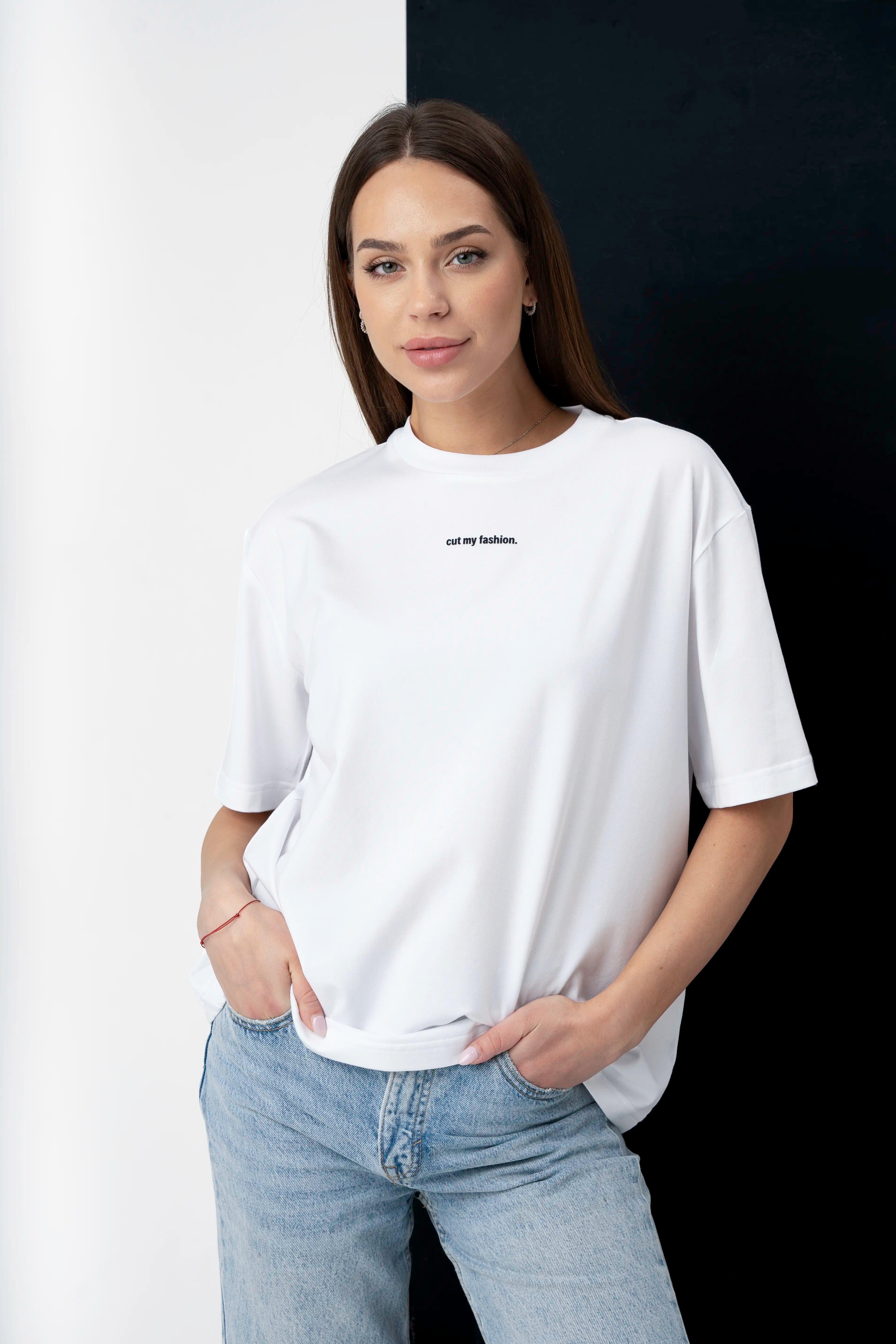White women's oversized T-shirts made from cotton fabric, close-up view with logo