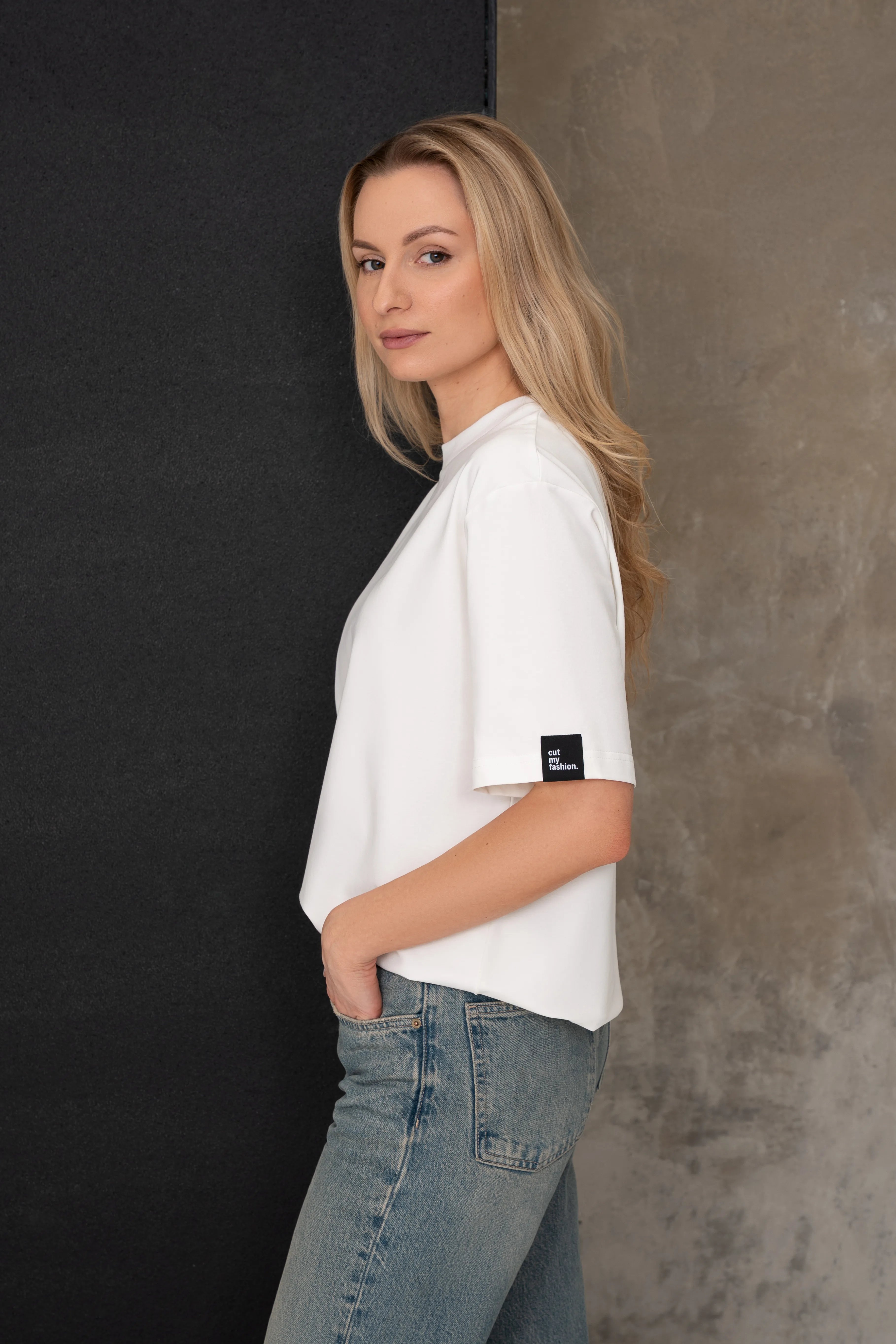 Women's milk white oversized cotton T-shirts, side view with label